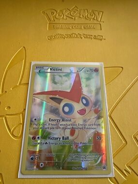 Pokémon Victini Holographic Card - Yellow/Red